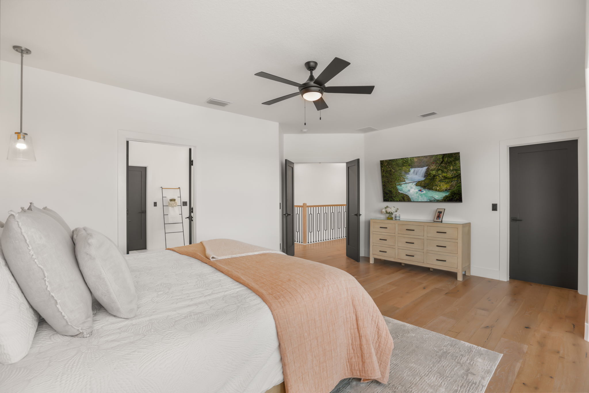 Primary bedroom with open doors